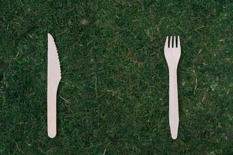 The concept of caring for the environment. On a natural background are a knife Stock Photos