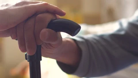 The concept of caring support for elderly sick people. The hand of a pensioner h Stock Footage 173822201