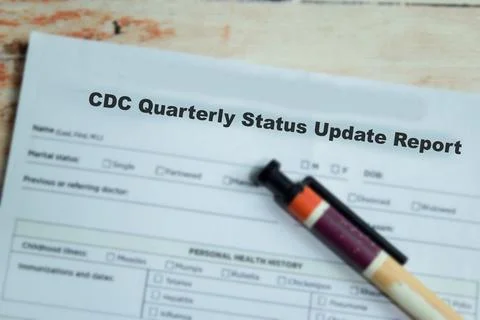 Concept of CDC quarterly status update report write on application Stock Photos