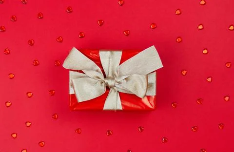 The concept of celebrating different holidays. Gift box with a golden bow on a Stock-Fotos