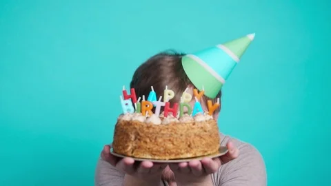 Concept of celebration and fun. Smiling happy crazy young man in party hat Stock Footage 107996860