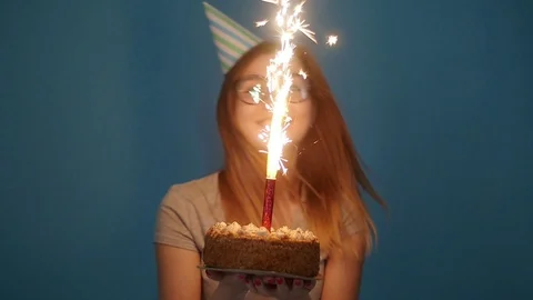 Concept of celebration and fun. Young cheerful funny girl with a birthday cake Stock Footage 108202250
