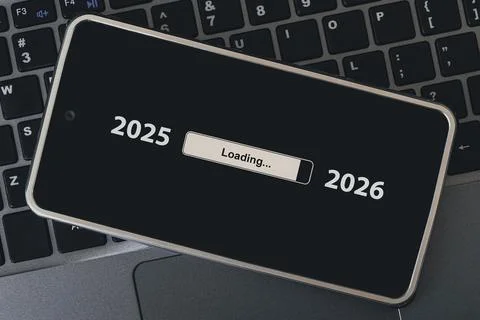 The concept of changing the year from 2025 to 2026. smartphone on the compute Stock Photos