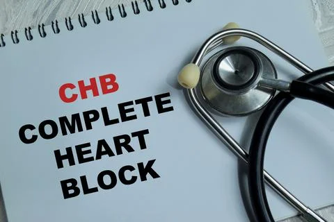 Concept of CHB - Complete Heart Block write on book isolated on Wooden Table Stock Photos