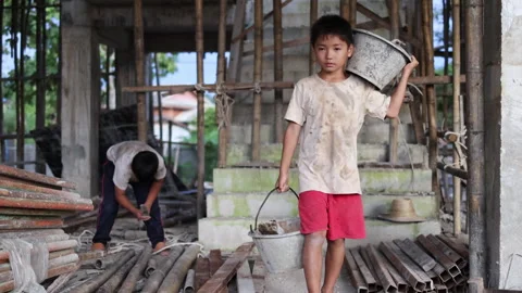 The concept of child labor, Poor children are forced to work in constructio.. Stock Footage 336942145