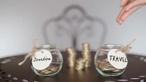 Concept of choice between donation and travel, problem of choice in saving money Stock Footage 148504334