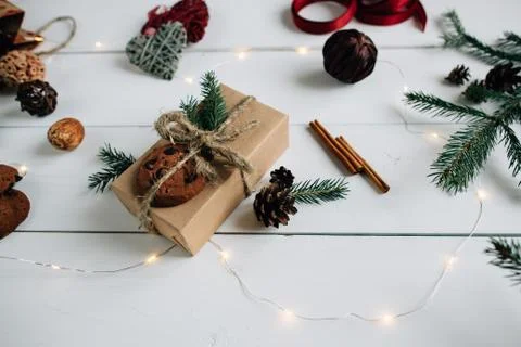 Concept of Christmas items on a rustic white wooden table. Stock Photos