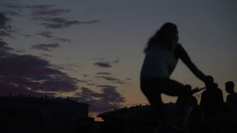 Concept of city Park in summer evening and healthy lifestyle. Silhouettes of Stock Footage 79633461