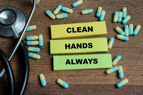 Concept of clean hands always write on sticky notes isolated on Wooden Table Stock Photos