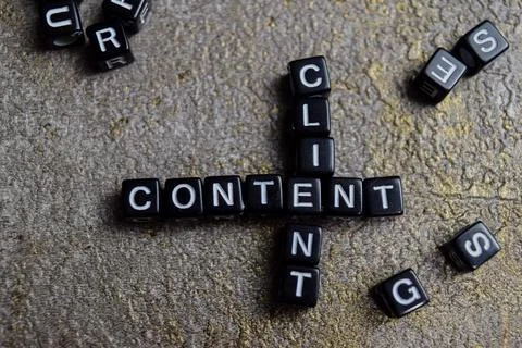 Concept of client and content words arranged with on wooden letter blocks. Stock Photos