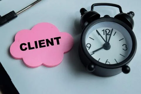 Concept of client write on sticky notes isolated on Wooden Table. Stock Photos