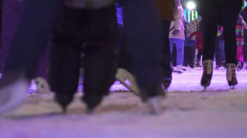 Concept Closeup Skate. Crowd at Night City Skating Rink. Pedestal and Blur 動画素材 70464331