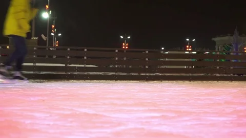 Concept Closeup Winter Sport. Crowd at Night City Skating Rink Pedestal and Blur Stock Footage 70528863