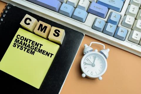 Concept of CMS - Content Management System write on sticky notes Stock Photos
