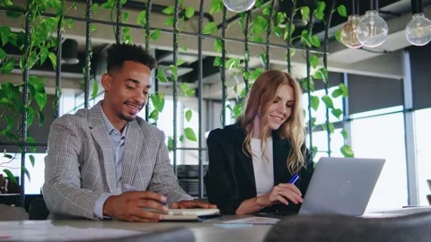 The concept of Collaborative Teamwork in a Modern Office Space emphasizes the im Video stock 283083277