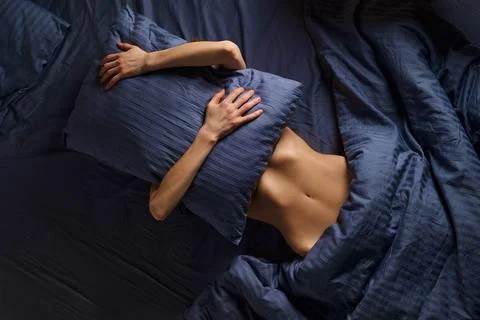 Concept of comfortable rest in bed, lazy weekend and introversion Stock Photos