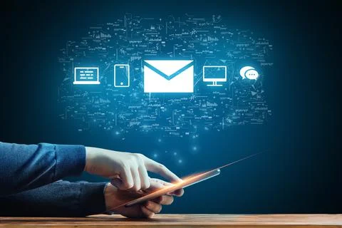 The concept of communication by email using different computers and smartphones. Stock Photos