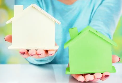 Concept comparison between normal house and low consumption house Stock Photos