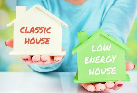 Concept comparison between normal house and low consumption house Stock Photos