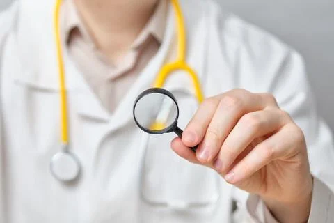 The concept of a comprehensive study of health problems doctor with a magnifi Stock Photos