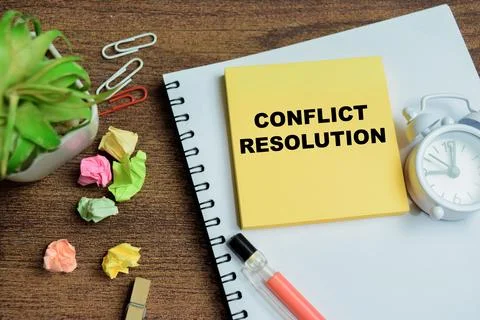 Concept of conflict resolution write on sticky notes isolated on Wooden Table 스톡 사진