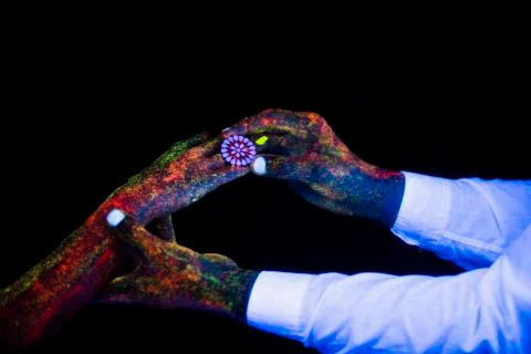 Concept of connecting hands creative wedding photography in neon light male and Stock Photos