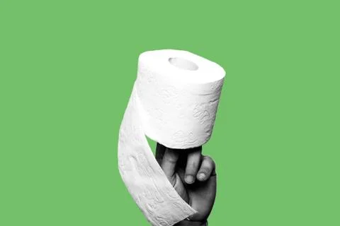 Concept of constipation, diarrhea, problem. Hand holding a toilet paper roll Stock Photos