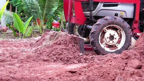 The concept of construction industry: a close up of the tractor works Stock Footage 105722333