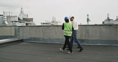 Concept of construction site engineer and architects analyzing the plan of Stock Footage 113460284