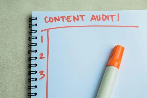Concept of Content Audit! write on book isolated on Wooden Table. Stock Photos