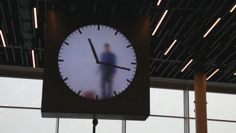 Concept in control of time man wiping out clock hand Stock Footage 98615714