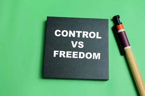 Concept of control vs freedom write on sticky notes isolated on table. Stock Photos
