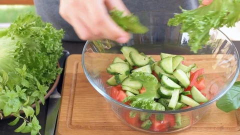 The concept of cooking vegetable salad . Stock Footage 76980549