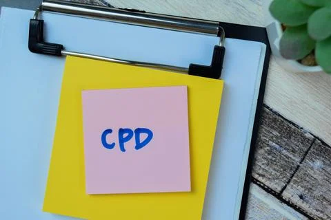 Concept of CPD write on sticky notes isolated on Wooden Table. 스톡 사진