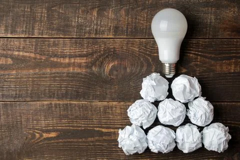 Concept creative idea. concept of creative idea. Bulbs of crumpled paper and Stock Photos