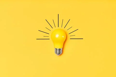 Concept creative idea with lightbulb on yellow background Stock Photos