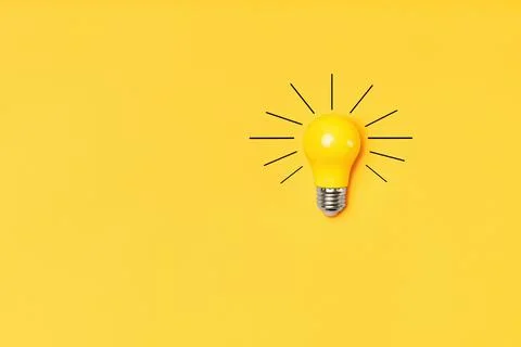 Concept creative idea with lightbulb on yellow background Stock Photos