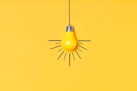 Concept creative idea with lightbulb on yellow background Stock Photos