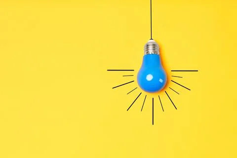 Concept creative idea with lightbulb on yellow background Stock Photos
