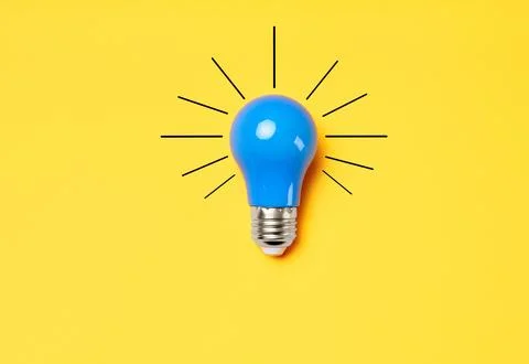 Concept creative idea with lightbulb on yellow background Solution symbol Stock Photos