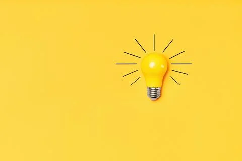 Concept creative idea with lightbulb on yellow background with copy space Stock Photos