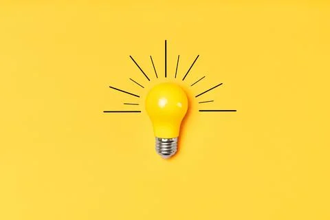 Concept creative idea with lightbulb on yellow background Solution symbol Stock Photos