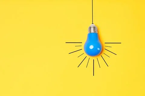 Concept creative idea with lightbulb on yellow background with copy space Stock Photos