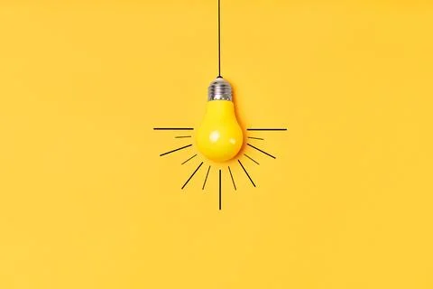 Concept creative idea with lightbulb on yellow background Solution symbol Stock Photos