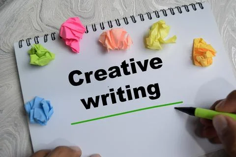Concept of creative writing write on book isolated on Wooden Table. Stock Photos