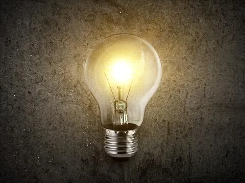 Concept creativity with bulbs that shine glitter on Concrete floor background Stock Photos