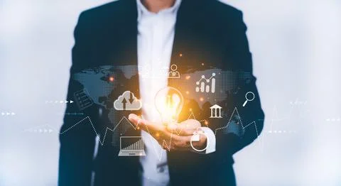 Concept creativity with light bulbs and energy power, Businessman hand holdin Stock Photos