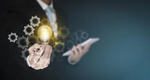 Concept creativity with light bulbs and energy power,Businessman hand holding Stock Photos
