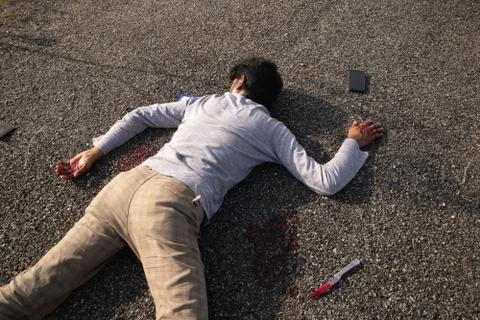 Concept of Crime or murder scene, Closeup of victim dead body murdered with k Stock Photos