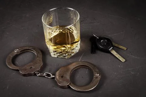 Concept of criminal liability for driving while intoxicated. Bakal with cogna Foto stock